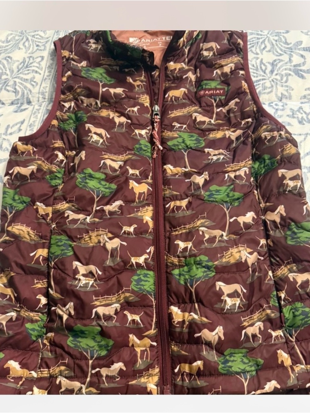 Ariat Women's Quilted Horse-Print Puffer Vest in burgundy & Green Accents